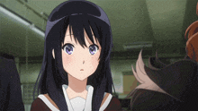 a girl with long black hair and purple eyes looks at something