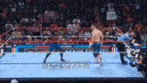 a wrestler in a ring with a sign that says cena on it