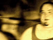 a blurry picture of a person 's face with a yellow colored background