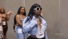 a woman wearing a name tag that says 3257