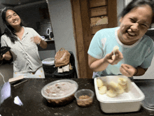 a woman wearing a columbia shirt is laughing