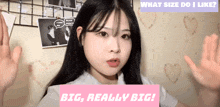 a girl with long black hair is standing in front of a pink sign that says " what size do i like "