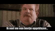 a man with a mustache and suspenders says ik voel me een beetje opgeblazen