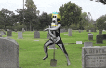 a man in a skeleton costume is digging in a graveyard