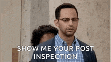 two men are standing next to each other and one of them is asking the other to show me your post inspection .