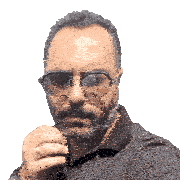 a man with a beard wearing sunglasses and a black polo shirt