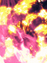 a pink and yellow background with a purple swirl in the middle