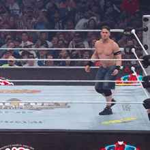 a man in a wrestling ring with a fox logo on the ring