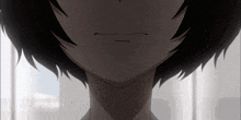 a close up of a person 's face with a slight smirk