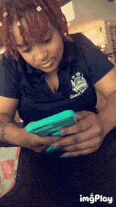 a woman in a blue shirt that says guest service