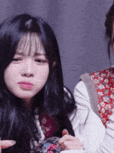 a close up of a girl making a face with her mouth open