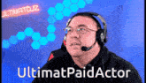 a man wearing headphones and a microphone with the words ultimatpaidactor written below him