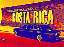 a car is parked in front of a sign that says costa rica