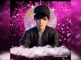 a picture of a boy with a disco ball behind him