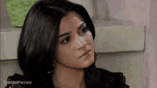 a close up of a woman 's face with the words sitemeiperroni written on the bottom
