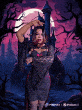 a woman in a vampire costume stands in front of a full moon