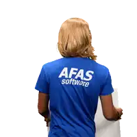 a man wearing a blue afas software shirt holds a sign