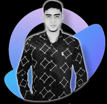 a young man wearing a black shirt with white x 's on it stands with his hands in his pockets