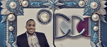 a man in a suit is smiling in front of a sign that says common center