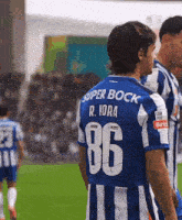 a soccer player wearing a jersey that says super bock