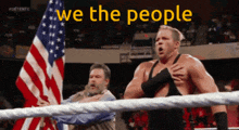 a man in a wrestling ring with the words we the people written above him