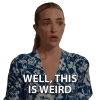 a woman in a blue and white floral dress is saying well this is weird