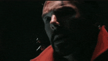 a close up of a man 's face with venom coming out of it .