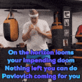 a man in a white shirt and blue shorts stands in front of a punching bag with the words on the horizon looms