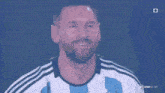 a man with a beard is wearing a blue and white striped jersey