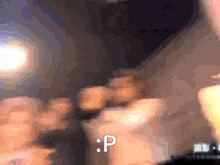 a blurred image of a person with the letter p visible