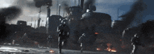 a group of soldiers are running in front of a large ship that says ' uss ' on the side