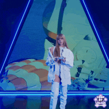 a woman holding a video game controller in front of a screen that says look at lalisa on it