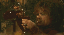 My Little Cousin'S Face When He Was Allowed To Have Wine At Dinner For The First Time GIF - Game Of Thrones Wine Tyrion GIFs