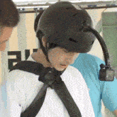 a person wearing a helmet with a camera attached to it