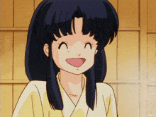 a girl with blue hair is smiling with her mouth wide open