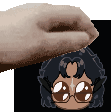 a hand is holding a cartoon character 's head in front of a black background .