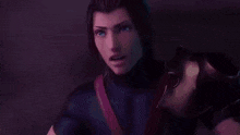 a man is standing in a dark room with a blue light shining on him .