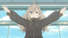 a girl in a black jacket is standing with her arms outstretched in front of a window