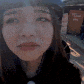 a girl wearing a helmet looks at the camera