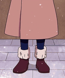 a person wearing a pink skirt and brown boots