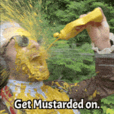 a man with mustard poured on his face and the words get mustarded on