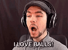 a man wearing headphones and a hat is saying i love balls