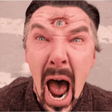 a man with a beard has a third eye on his face
