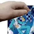 a person is holding a donut over a picture of a person in a blue suit .