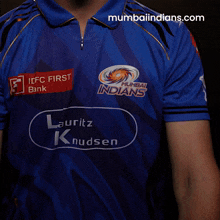 a man in a blue shirt that says mumbai indians