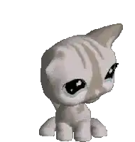 a littlest pet shop cat is crying and looking at the camera with a white background .