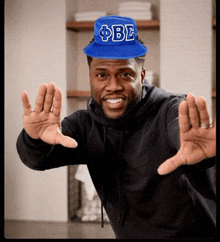 a man wearing a blue hat that says o be on it