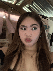 a woman making a funny face with her mouth open