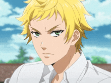 a man with yellow hair and green eyes looks angry