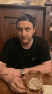 a man wearing a black t-shirt with the word pro on it